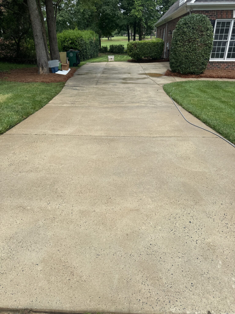 concrete driveway cleaning showing a smooth surface with no visible stains or debris present